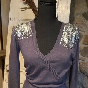 Sequin shoulders make this a stunner! It does run small.